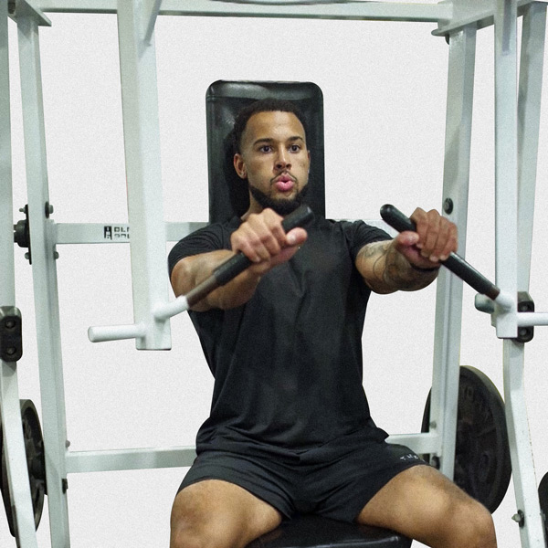 Machine Decline Bench Press - Exercise Guide | Motra